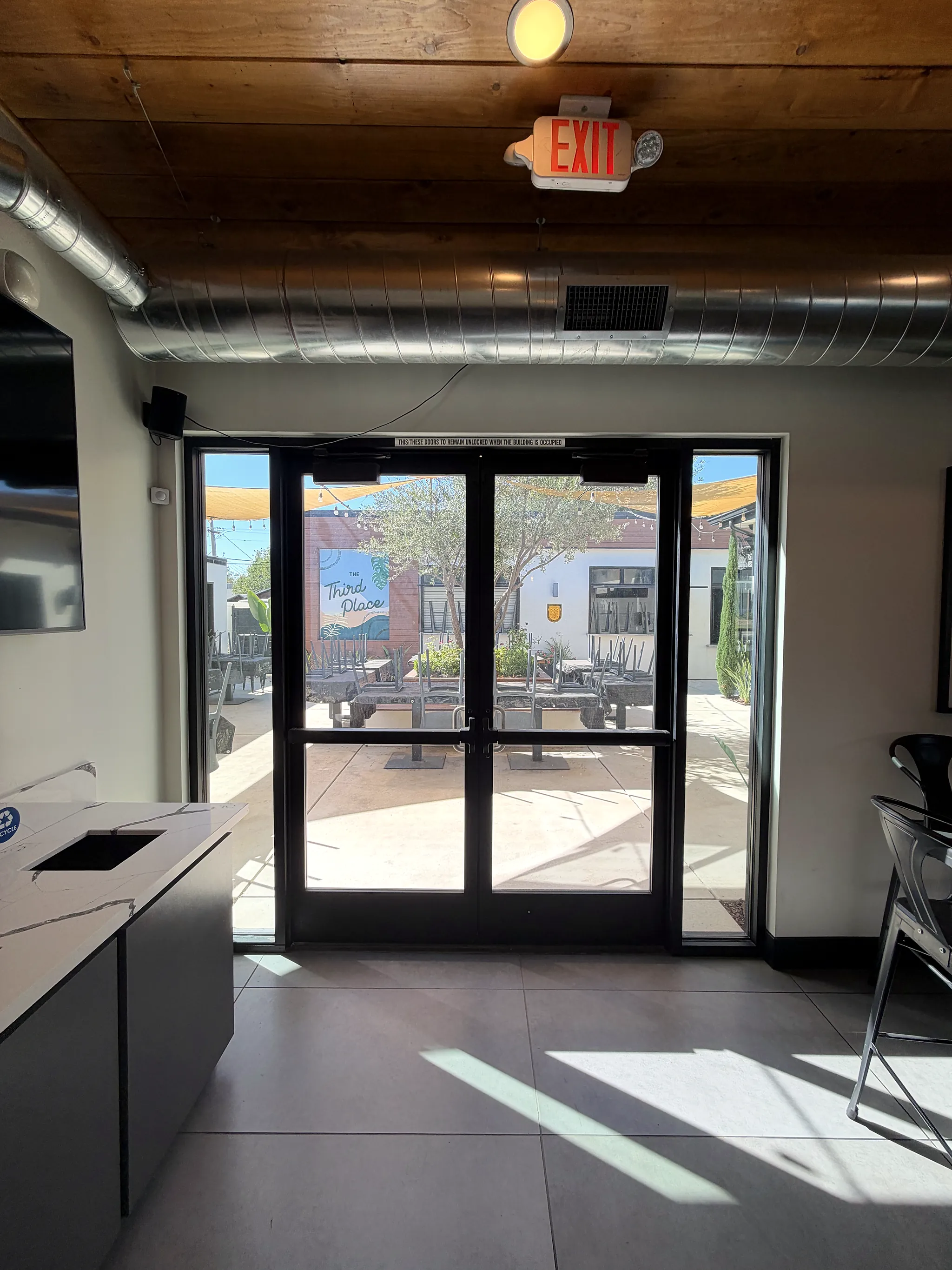 Glass doors opening from the dining room to the courtyard
