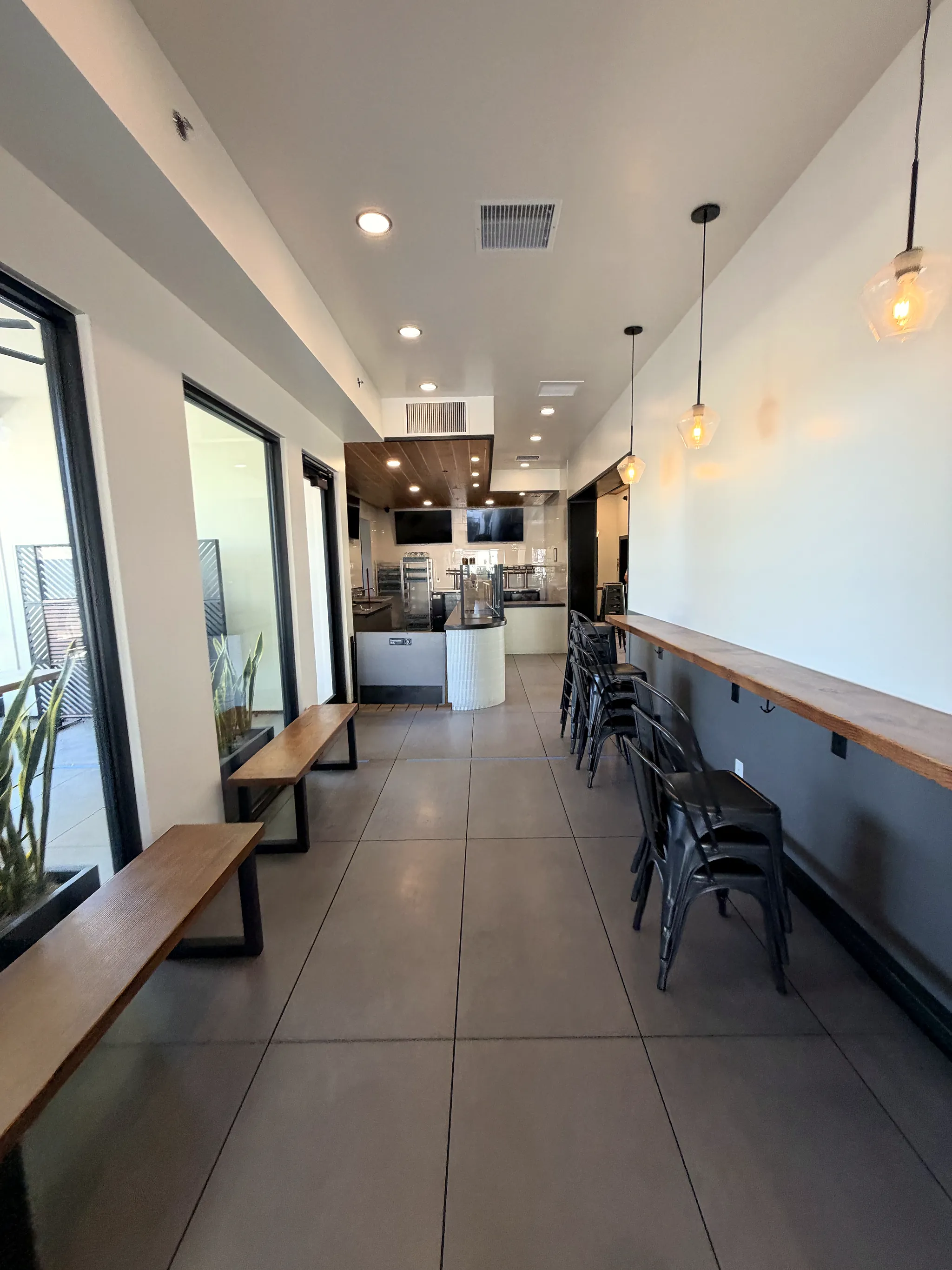 Window counter seating with pendant lights