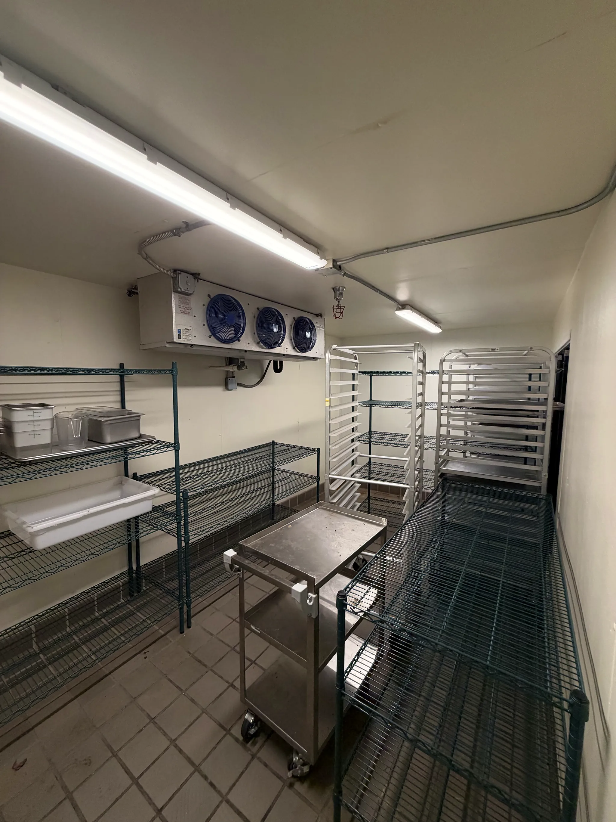 Walk-in cooler with shelving and sheet-pan racks