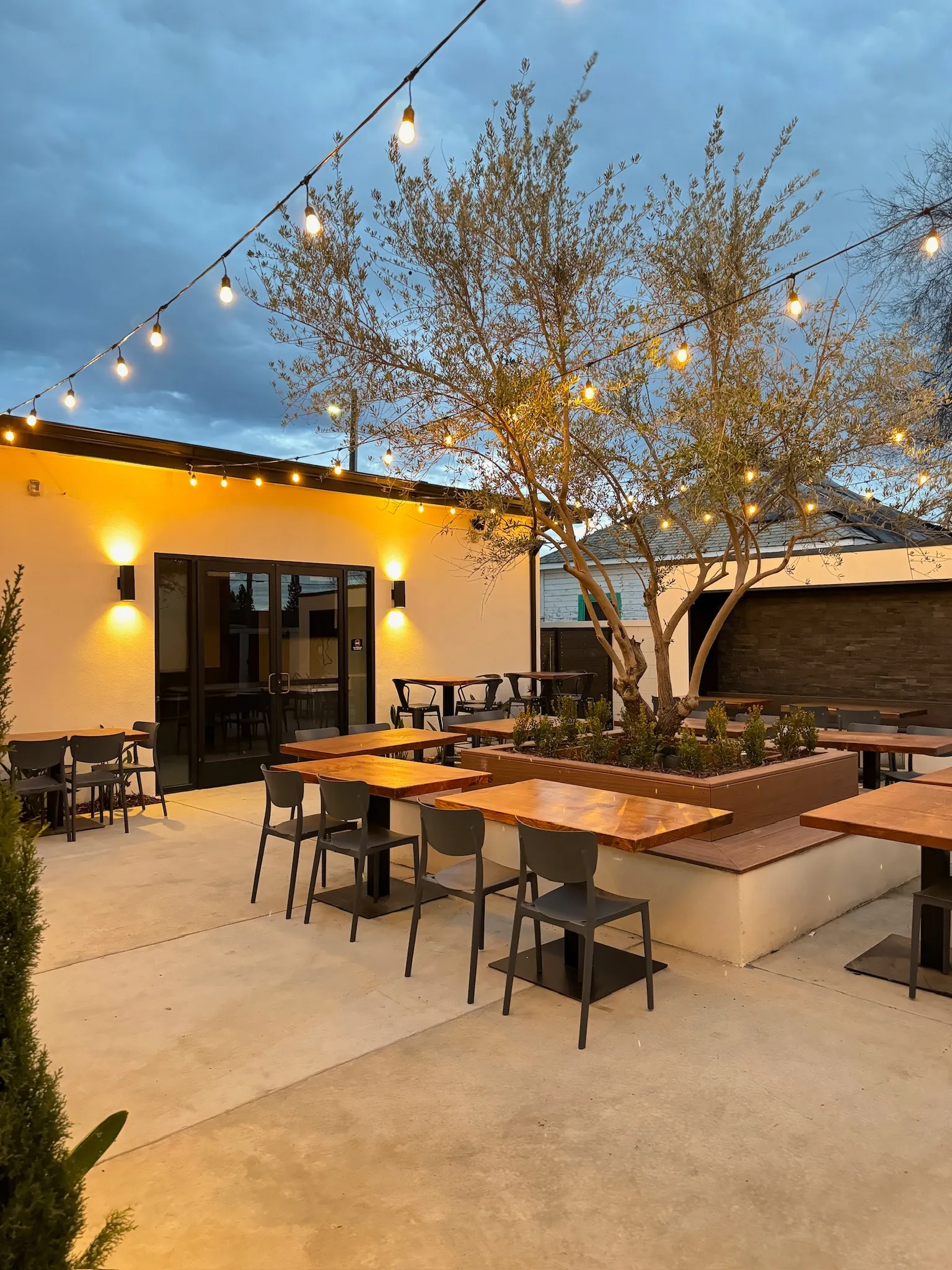 Courtyard seating glowing at golden hour
